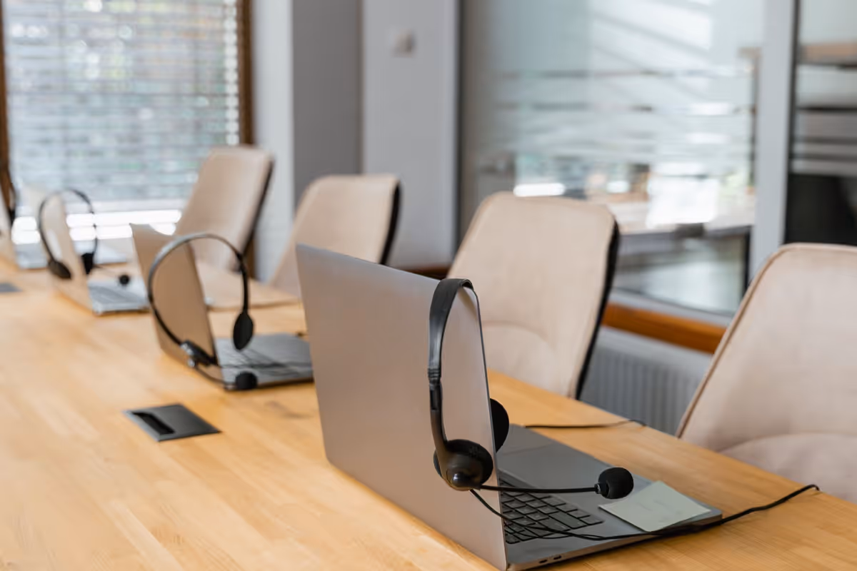 Customer support desk headset suggesting outcomes agents cannot fake alone.