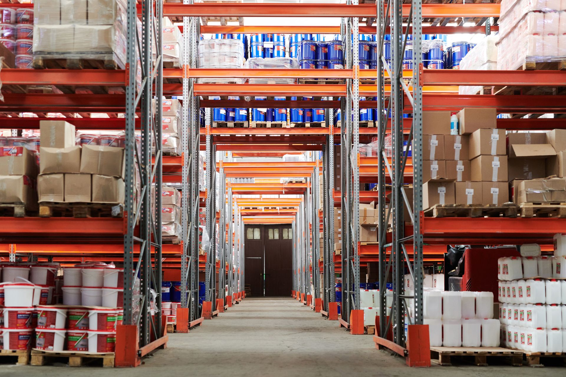 Cross-border warehouse desk with two phones and shipping cartons suggesting multi-channel commerce.